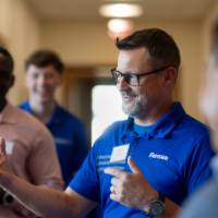 Jason Botsford speaking to guests at event